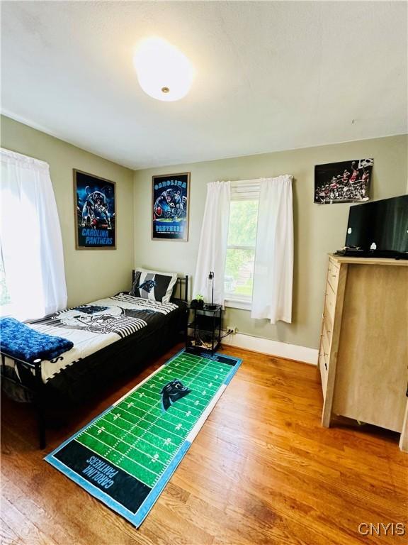 300 Hillsdale Ave, Syracuse, NY 13206 - bedroom with wood finished floors and baseboards