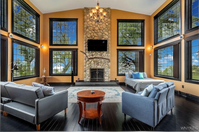 2300 Washington Ave, Wilson, NY 14172 - living room with a stone fireplace, hardwood / wood-style floors, high vaulted ceiling, and a chandelier