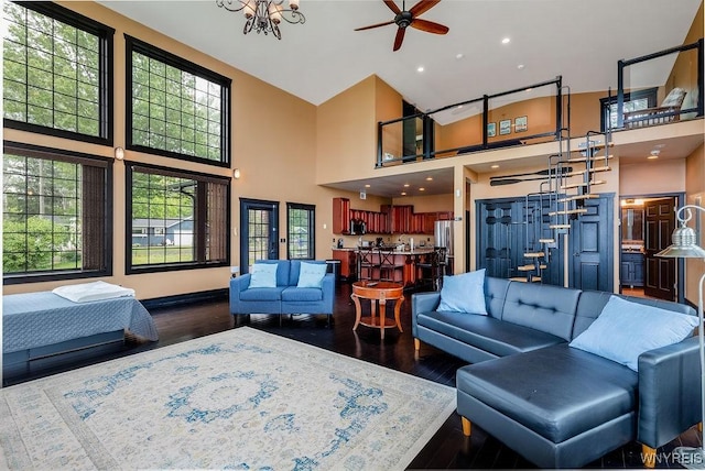 2300 Washington Ave, Wilson, NY 14172 - living room with dark wood finished floors, a towering ceiling, healthy amount of natural light, and ceiling fan