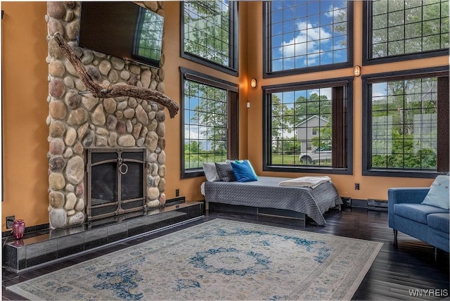 2300 Washington Ave, Wilson, NY 14172 - bedroom featuring a fireplace and wood finished floors