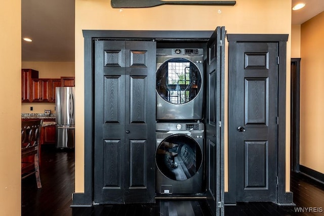 2300 Washington Ave, Wilson, NY 14172 - washroom with stacked washer / drying machine, dark wood finished floors, and recessed lighting