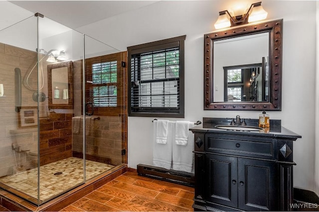2300 Washington Ave, Wilson, NY 14172 - full bath with vanity, a shower stall, and wood finished floors