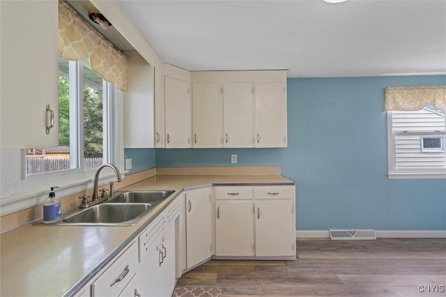 130 Hillcrest Rd, Onondaga, NY 13219 - kitchen with light countertops, wood finished floors, and white cabinets