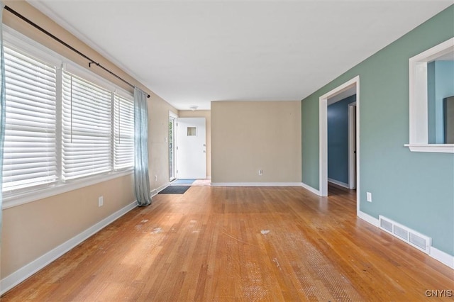 130 Hillcrest Rd, Onondaga, NY 13219 - unfurnished living room featuring baseboards and light wood-style flooring