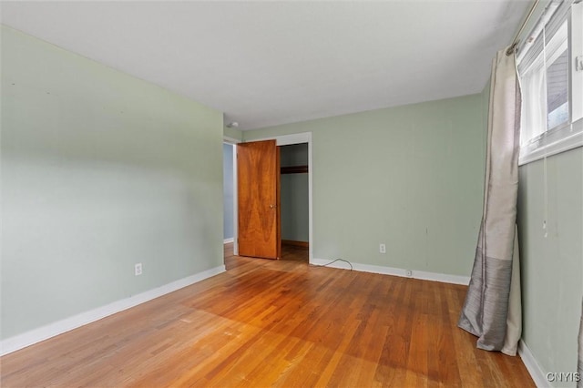 130 Hillcrest Rd, Onondaga, NY 13219 - unfurnished bedroom with wood finished floors and a closet