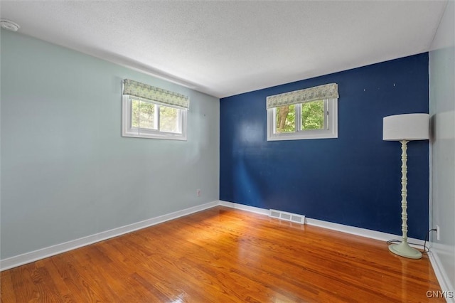 130 Hillcrest Rd, Onondaga, NY 13219 - unfurnished room with wood finished floors and a textured ceiling