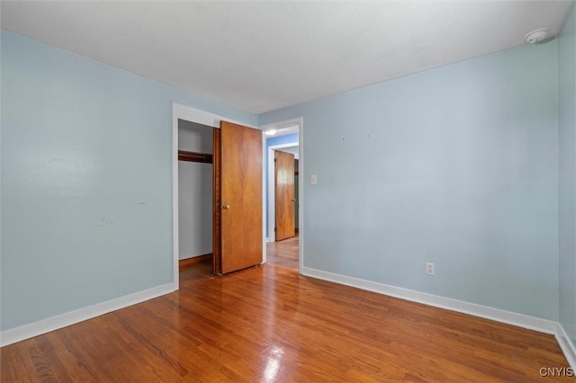 130 Hillcrest Rd, Onondaga, NY 13219 - unfurnished bedroom with wood finished floors and a closet