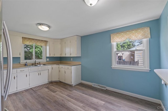130 Hillcrest Rd, Onondaga, NY 13219 - kitchen featuring stainless steel refrigerator, light countertops, and light wood-type flooring