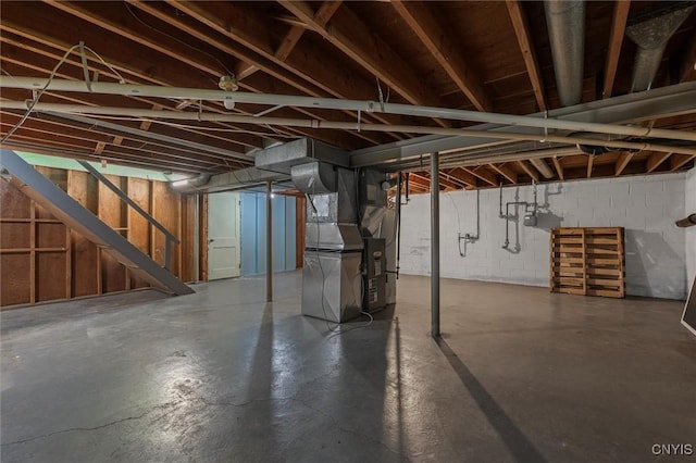 130 Hillcrest Rd, Onondaga, NY 13219 - unfinished basement with heating unit and stairway