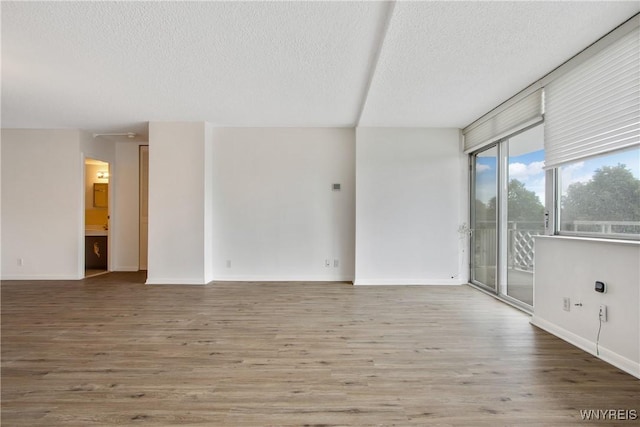 1088 Delaware Ave Unit 3B, Buffalo, NY 14209 - spare room featuring a textured ceiling and wood finished floors