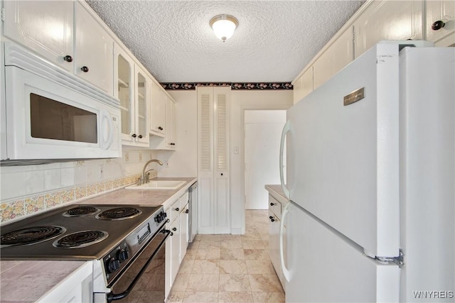 1088 Delaware Ave Unit 3B, Buffalo, NY 14209 - kitchen featuring white appliances, glass insert cabinets, light countertops, a textured ceiling, and white cabinets