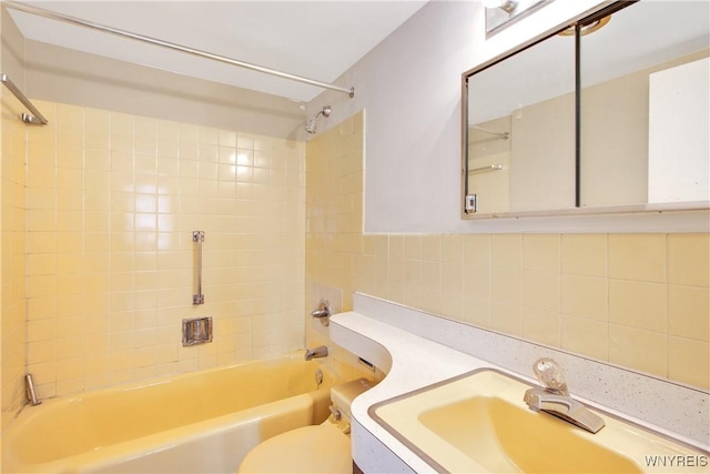 1088 Delaware Ave Unit 3B, Buffalo, NY 14209 - bathroom with  shower combination, vanity, tasteful backsplash, and tile walls