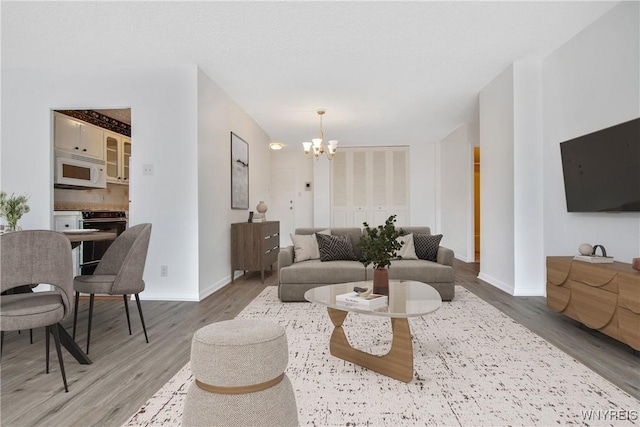 1088 Delaware Ave Unit 3B, Buffalo, NY 14209 - living area featuring a chandelier and light wood-type flooring