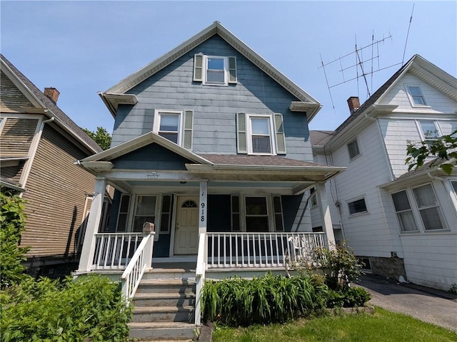 918 S Goodman St, Rochester, NY 14620 - american foursquare style home featuring a porch