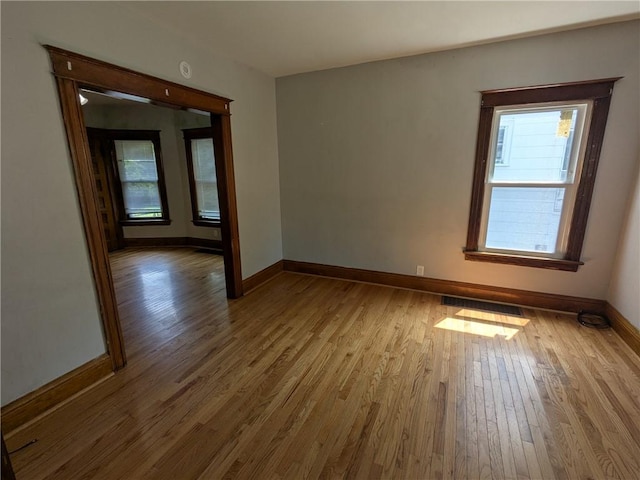 918 S Goodman St, Rochester, NY 14620 - spare room featuring wood finished floors and baseboards