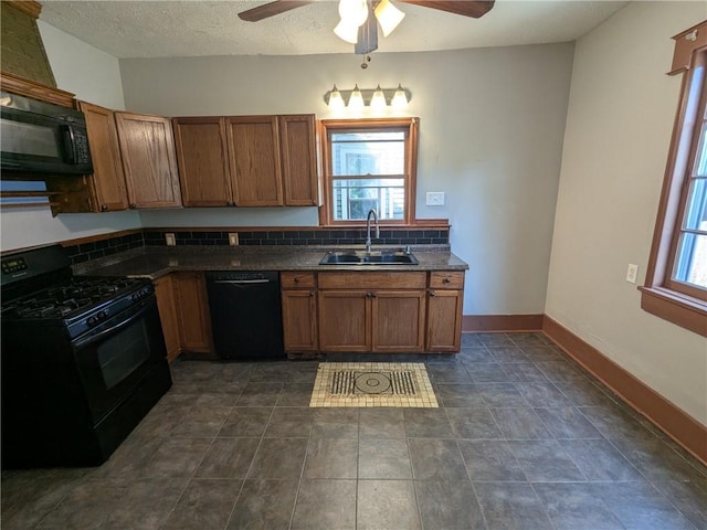 918 S Goodman St, Rochester, NY 14620 - kitchen with black appliances, dark countertops, a ceiling fan, brown cabinetry, and a textured ceiling