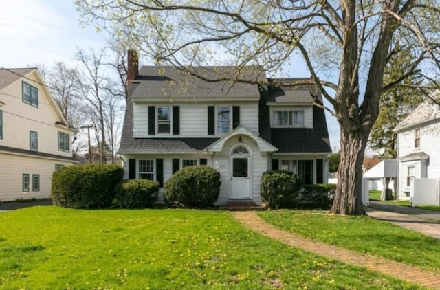1206 W Water St, Elmira, NY 14905 - view of front of house with a front lawn and a chimney
