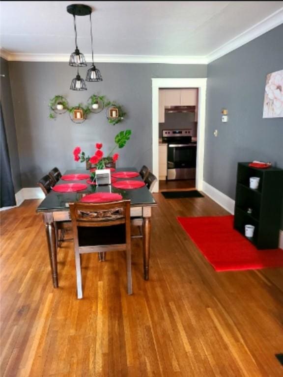 1206 W Water St, Elmira, NY 14905 - dining space featuring wood finished floors and crown molding