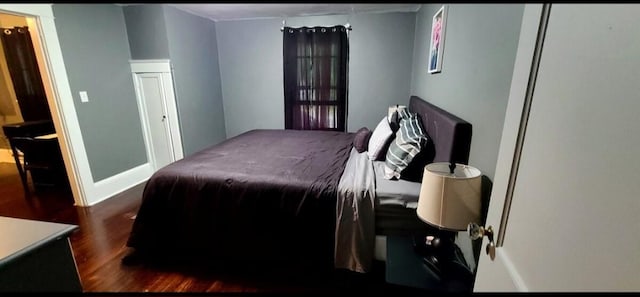 1206 W Water St, Elmira, NY 14905 - bedroom featuring dark wood-type flooring and baseboards
