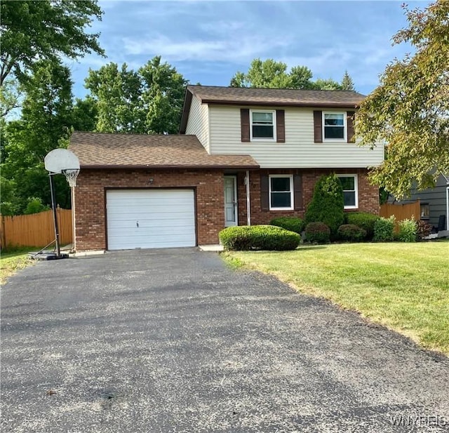 790 Mohawk St, Lewiston, NY 14092 - view of front facade with a garage, asphalt driveway, and brick siding