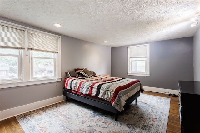 2092 Titus Ave, Irondequoit, NY 14622 - bedroom with a textured ceiling, wood finished floors, and recessed lighting