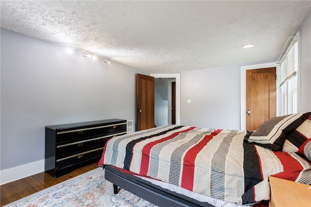 2092 Titus Ave, Irondequoit, NY 14622 - bedroom featuring wood finished floors and a textured ceiling