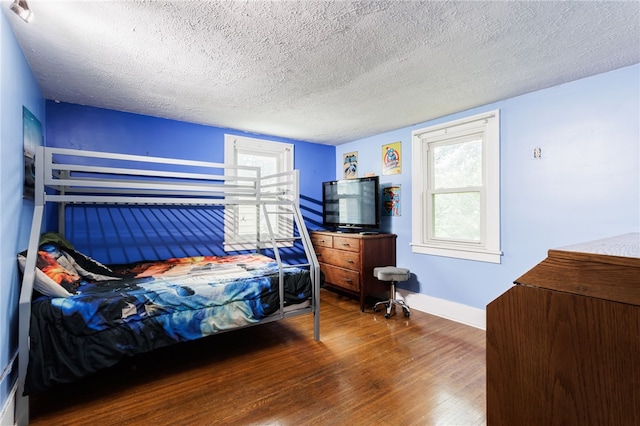 2092 Titus Ave, Irondequoit, NY 14622 - bedroom featuring wood finished floors and a textured ceiling