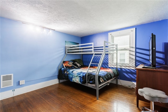2092 Titus Ave, Irondequoit, NY 14622 - bedroom with wood finished floors and a textured ceiling