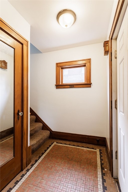 2092 Titus Ave, Irondequoit, NY 14622 - hall featuring brick patterned flooring and stairway