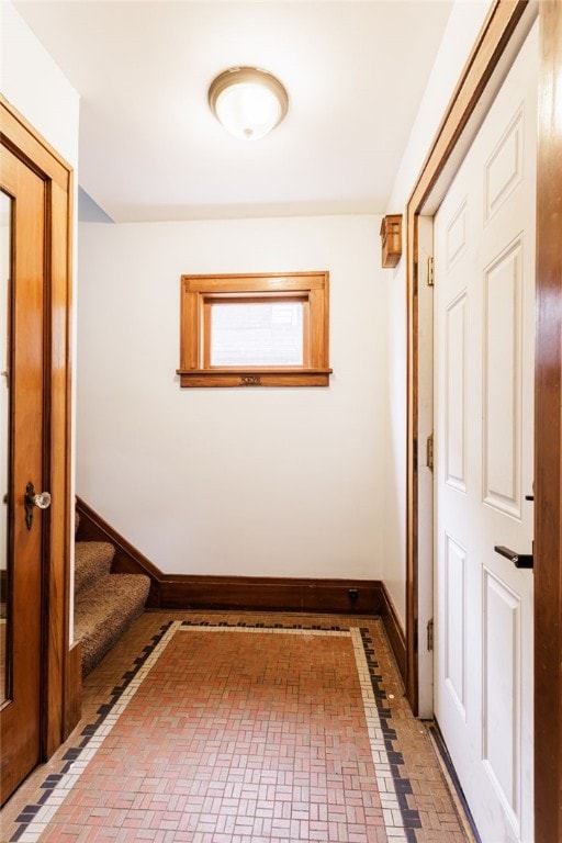 2092 Titus Ave, Irondequoit, NY 14622 - corridor featuring brick patterned floors and stairway
