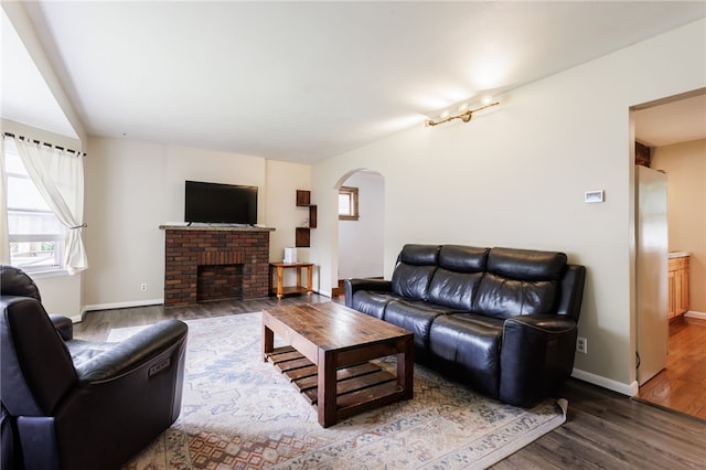 2092 Titus Ave, Irondequoit, NY 14622 - living area with arched walkways, wood finished floors, and a fireplace