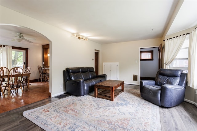 2092 Titus Ave, Irondequoit, NY 14622 - living room featuring wood finished floors, arched walkways, and ceiling fan