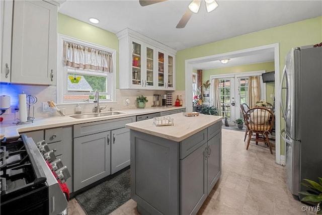 108 Phillips Rd, Syracuse, NY 13214 - kitchen featuring stainless steel appliances, gray cabinets, french doors, light countertops, and plenty of natural light