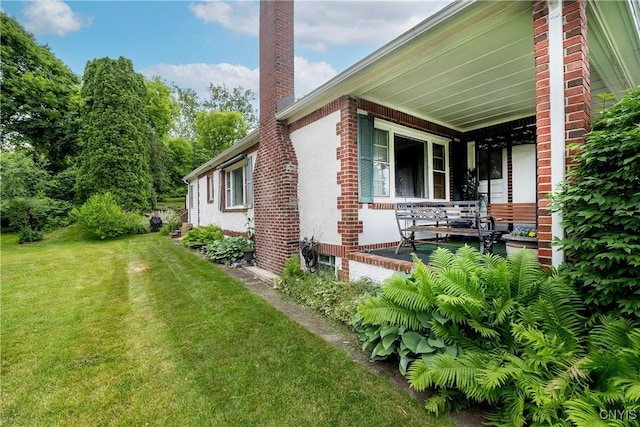 108 Phillips Rd, Syracuse, NY 13214 - view of side of home featuring a chimney, a lawn, brick siding, and covered porch