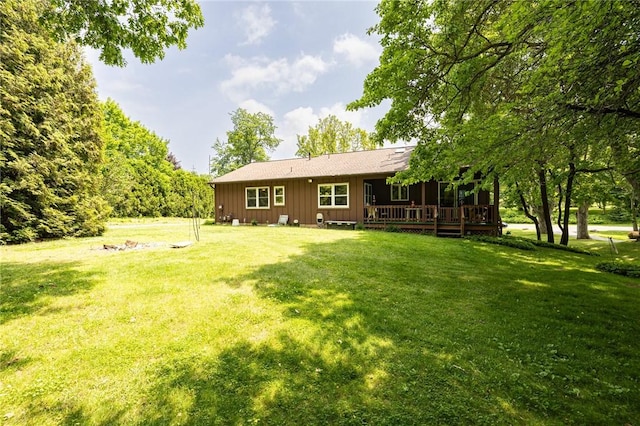 745 Maple Dr, Webster, NY 14580 - rear view of property featuring board and batten siding, a lawn, and a wooden deck