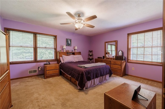 745 Maple Dr, Webster, NY 14580 - bedroom featuring light carpet, a ceiling fan, and a textured ceiling