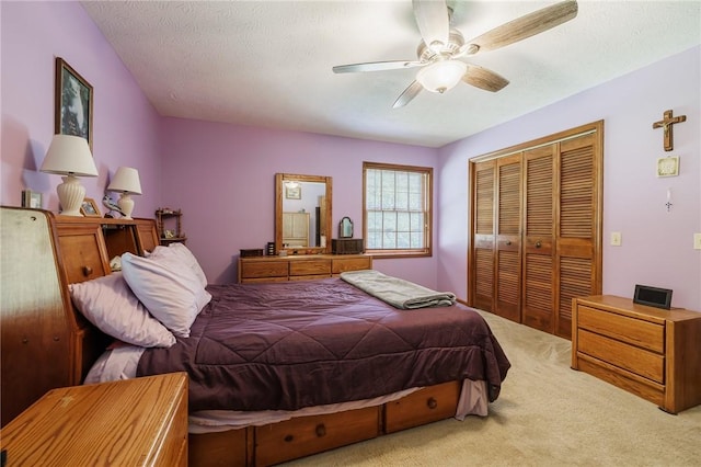 745 Maple Dr, Webster, NY 14580 - carpeted bedroom featuring a closet, ceiling fan, and a textured ceiling