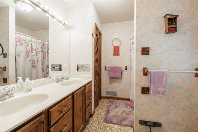 745 Maple Dr, Webster, NY 14580 - bathroom featuring double vanity and tile patterned floors
