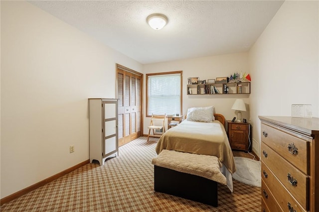 745 Maple Dr, Webster, NY 14580 - carpeted bedroom with baseboards and a textured ceiling