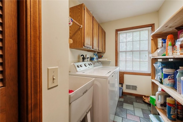 745 Maple Dr, Webster, NY 14580 - laundry area featuring cabinet space, separate washer and dryer, and stone finish floors