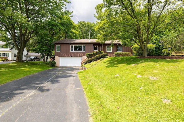 745 Maple Dr, Webster, NY 14580 - view of front of property featuring driveway, a garage, and a front lawn