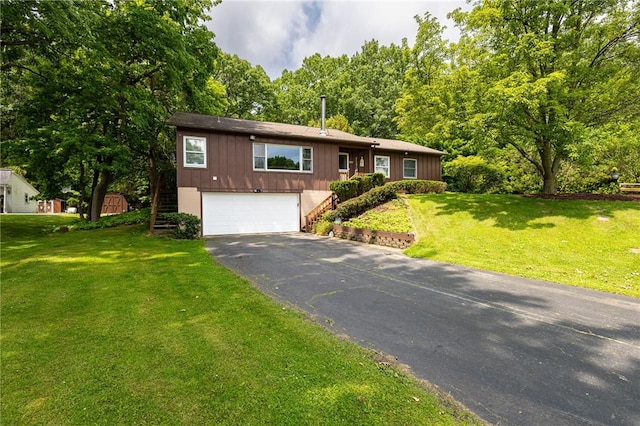 745 Maple Dr, Webster, NY 14580 - ranch-style house featuring asphalt driveway, an attached garage, stairs, and a front yard