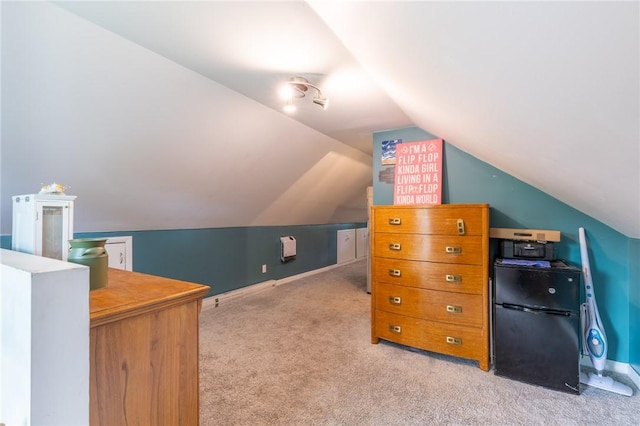 434 Crossfield Rd, Irondequoit, NY 14609 - bedroom featuring freestanding refrigerator, light carpet, and lofted ceiling
