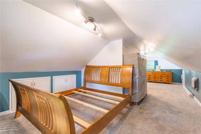434 Crossfield Rd, Irondequoit, NY 14609 - carpeted bedroom featuring lofted ceiling, heating unit, and multiple closets