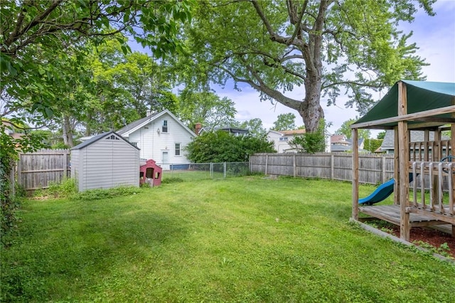 434 Crossfield Rd, Irondequoit, NY 14609 - fenced backyard with a storage shed and a playground