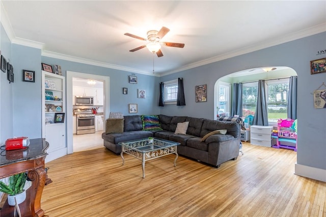 434 Crossfield Rd, Irondequoit, NY 14609 - living area featuring a ceiling fan, arched walkways, light wood-style floors, and ornamental molding