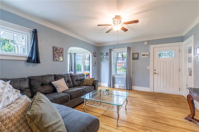 434 Crossfield Rd, Irondequoit, NY 14609 - living room with arched walkways, ceiling fan, light wood-type flooring, and crown molding