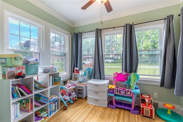 434 Crossfield Rd, Irondequoit, NY 14609 - game room with wood finished floors, ornamental molding, and a ceiling fan