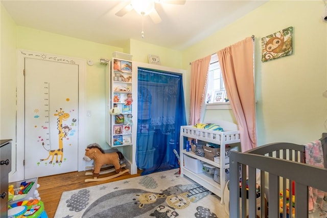 434 Crossfield Rd, Irondequoit, NY 14609 - bedroom with wood finished floors, a closet, ceiling fan, and a nursery area