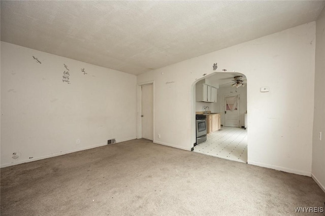 34 Schiller St, Buffalo, NY 14206 - unfurnished room featuring arched walkways, light carpet, and ceiling fan